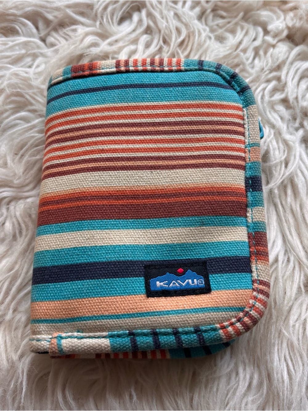 KAVU Zippy Wallet in the vibrant Tri Cascades striped pattern